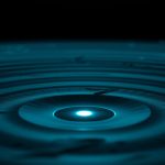 Sonar waves radiating from a single point over dark terrain — active scanning versus a cached search index